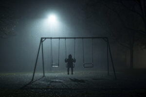 lone-figure-swing-set-night